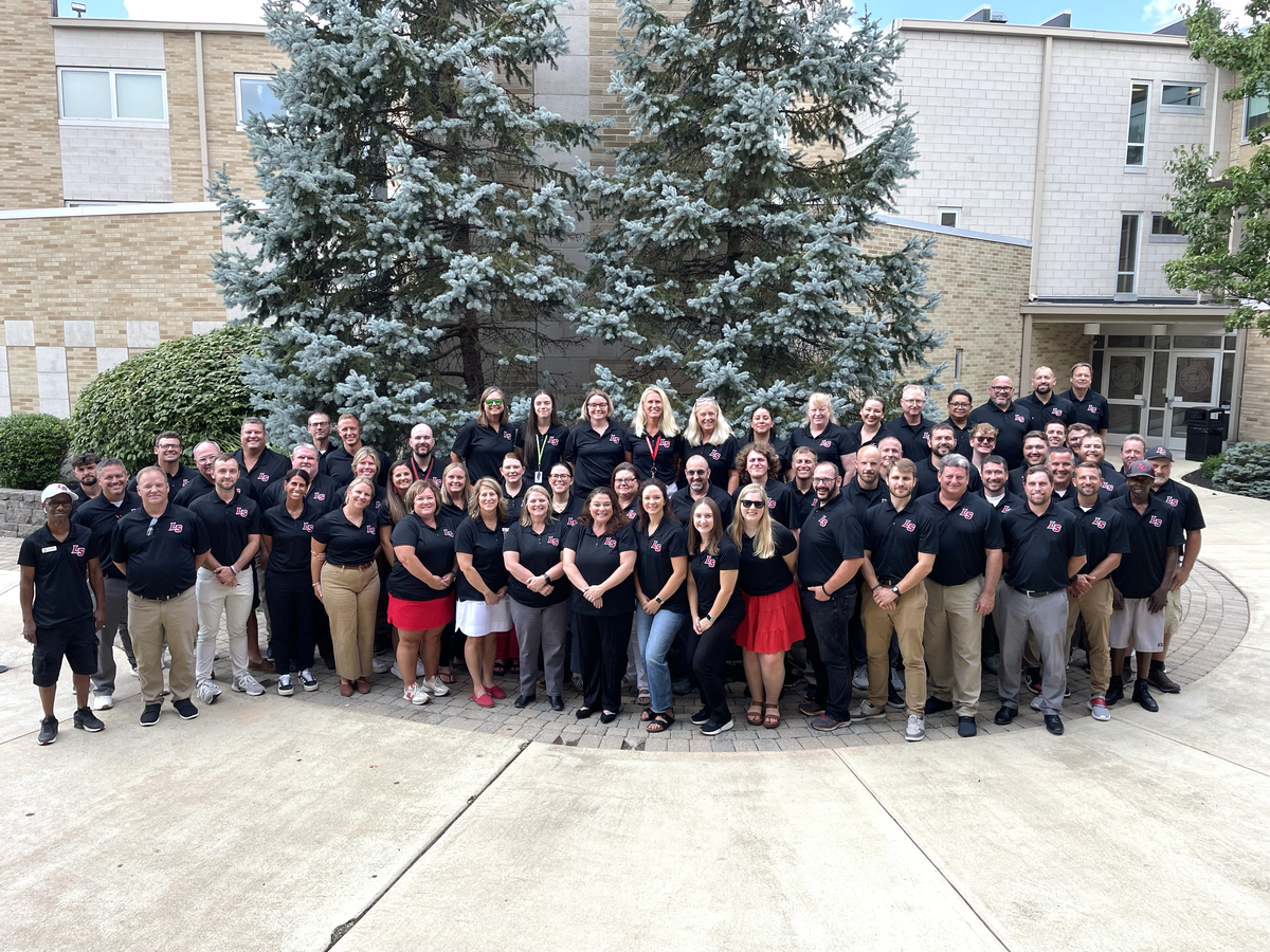 La Salle staff members in courtyard